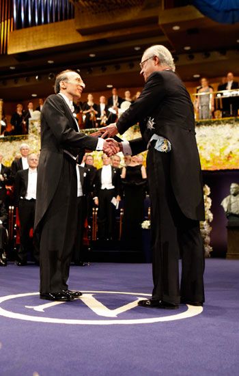 Saul receiving his Nobel Prize from the King.
